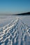 Snow-Enshrined Journey: Beaten Pathway on Winter\\\'s Golden Beach. Garciema Pludmale, Latvija