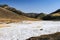 Snow at the entrance of the Yolyn Am or Yoliin Am canyon in spring,  Gobi Gurvansaikhan National Park. Gobi desert, Mongolia