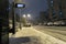 Snow falling in Jerusalem, an electronic sign for a bus stop that says in Hebrew that there is no public transportation due to the