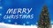 Snow falls on the Christmas fir tree branches on the blue background with heavy snow and text animation