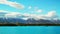 Snow filled mountain tops at blue Lake Pukaki