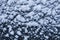 Snow flakes white texture on black background