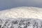 Snow on Geal Charn in the Cairngorms National Park of Scotland