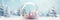 Snow globe with wintry scene, miniature trees and pastel-colored ornaments. Christmas banner with copy space. Winter