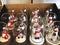 Snow globes with different figures inside. Snowmen and dwarfes. Christmas decor. Christmas concept