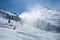 Snow gun in action, on ski slopes with artificial snow