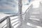 Snow and ice covered stairs, with strong sun backlight