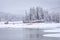 Snow on Jenkinson Lake and fir trees in Sierra Nevada Mountains, California