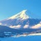 Snow kissed Fuji mountain summit stands out in breathtaking winter scenery