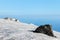 Snow on lava stone on mount etna