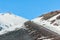 Snow on lava stone on mount etna