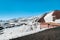 Snow on lava stone on mount etna