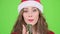 Snow maiden sings in a retro microphone and dances with energetic music. Green screen. Close up