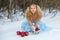 Snow Maiden in a winter forest with apples