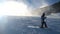 Snow making on slope. Skier near a snow cannon making fresh powder snow. Mountain ski resort in winter calm.