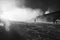 Snow making on slope. Skier near a snow cannon making fresh powder snow. Mountain ski resort in winter calm.