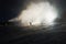 Snow making on slope. Skier near a snow cannon making fresh powder snow. Mountain ski resort in winter calm.