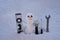 Snow man. Repairman with repair tools. Support repair and recover service. Happy smiling snowman on sunny winter day.