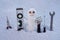Snow man. Repairman with repair tools. Support repair and recover service. Snowman on the background of snowflakes