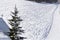 Snow marked by skis in a track