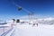 Snow mountain glade with ski lifts