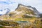 Snow mountain peak around Alnesvatnet lake panorama, path of trolles, Trollstigen, Rauma Municipality, More og Romsdal, county,