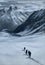 Snow mountain trekking, people walking on the snow trail.
