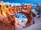 snow on natural bridge arch in bryce canyon national park. Generative AI