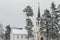 Snow on nordic church in forest at winter