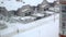 Snow over cottages and multi storey houses