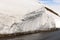 Snow parapet along road on Cross Pass of Georgian Military Highway in late spring. Caucasian ridge