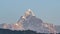 Snow Peak of Machapuchare Mountain also called Fishtail Mountain at Sunrise in the Himalayas in Nepal. Timelapse