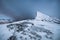 Snow peak of mount Segla in blizzard on winter at Senja island