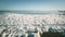 Snow pile, hill. Large snow drift isolated on a blue sky background,  outdoor view of ice blocks at frozen finland lake in winter