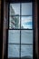 Snow piles above window sill after winter storm