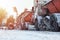 Snow plow removing snow from city road. Snowplow truck working in the street