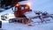 Snow plow truck on ski slope