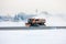 Snow-removal machine cleans the main taxiway at the airport