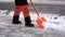 Snow removal from the sidewalk after a snowstorm.A road worker clears the sidewalk of snow