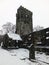 The snow on ruined medieval church in heptonstall with graveyard