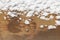 Snow on rusty metal texture background close up