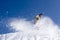 Snow Skier Jumping Against Blue Sky