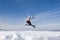 Snow Skier Jumping Against Blue Sky