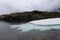 Snow slab on the lake and its reflection.