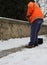 Snow spreader shovels the sidewalks