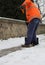 Snow spreader shovels the sidewalks after the snowfall