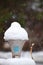 Snow on Street Lamp looking like Icecream Cone with White Snow Flakes in Air - Active Snowfall during Winter