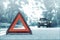 Snow time black car have accident park on road. Red triangle, red emergency stop sign, red emergency symbol and black car stop and