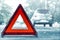 Snow time black car have accident park on road. Red triangle, red emergency stop sign, red emergency symbol and black car stop and