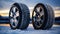 Snow tires on winter landscape background